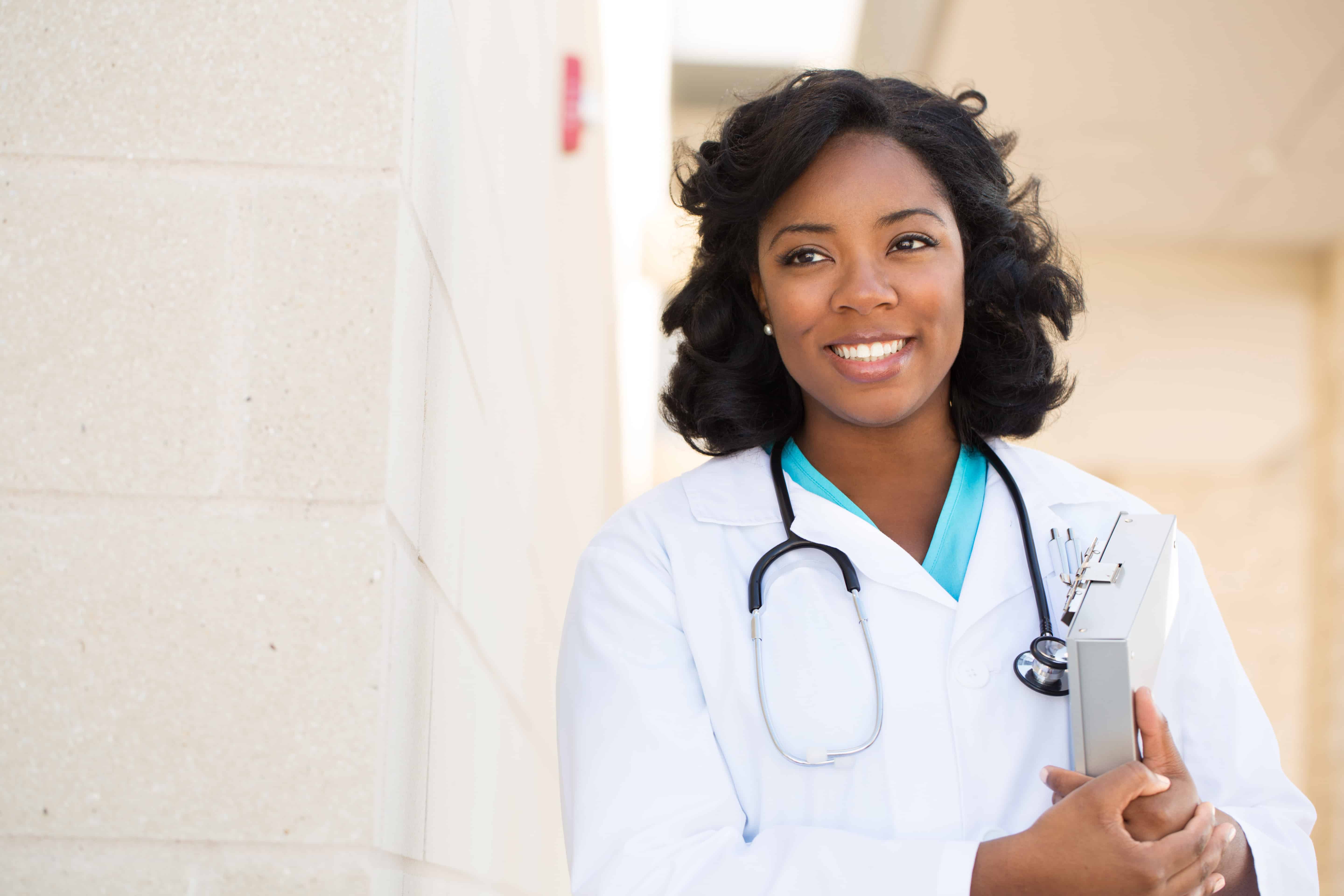 Female Black doctor with clipboard and stethoscope