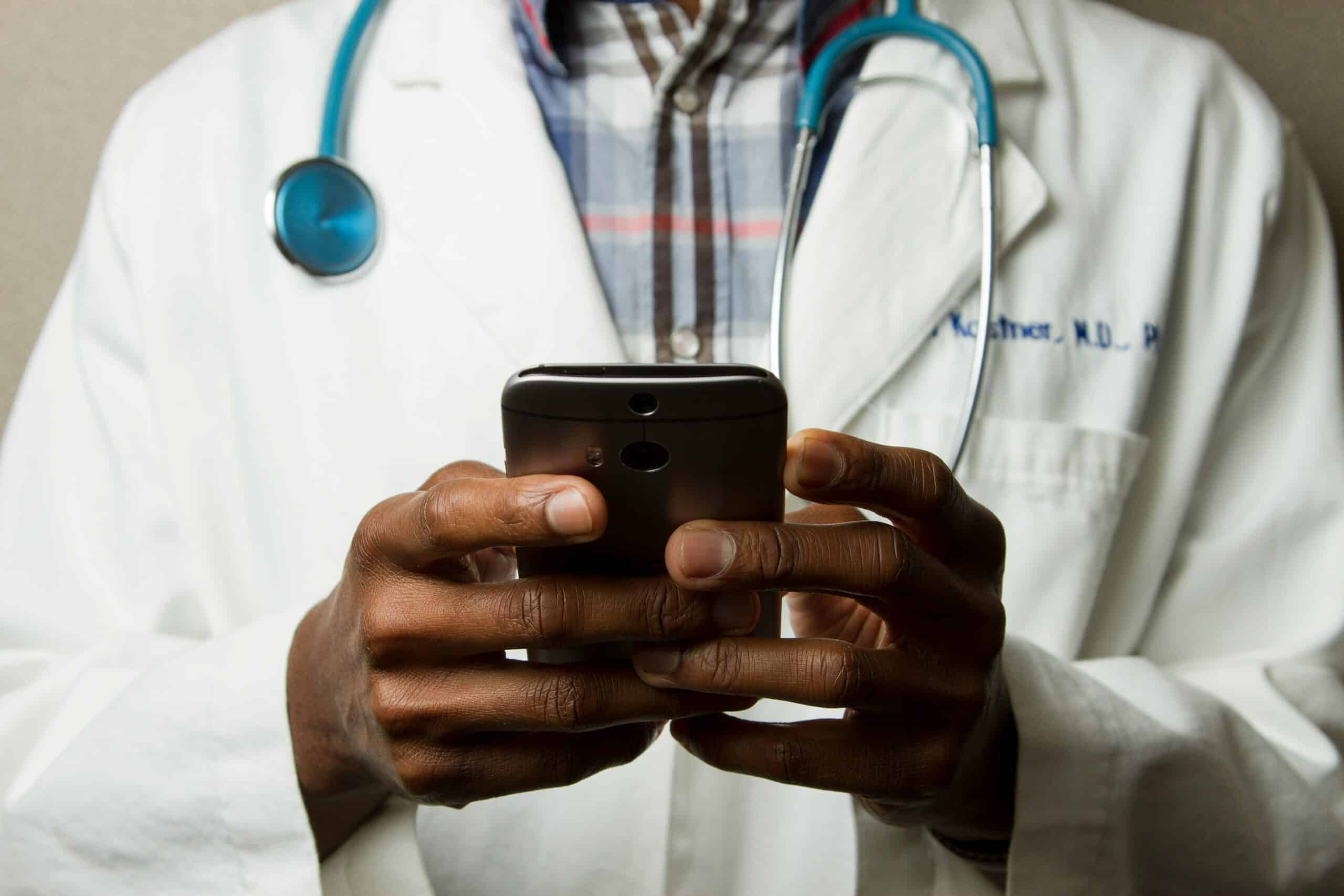 black male doctor on phone