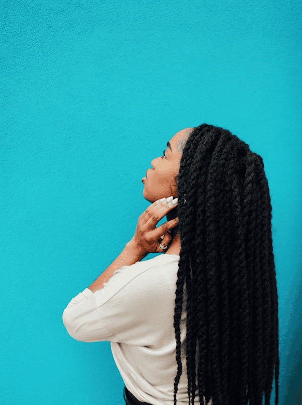 Profile of individual in front of blue backdrop