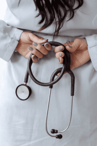 Doctor holding stethoscope