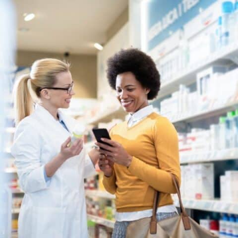 A woman consulting a pharmacist